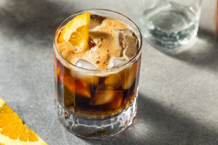 Refreshing Boozy Espresso Tonic Drink with an Orange Garnish