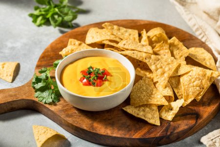 Photo for Warm Homemade Cheesy Queso Dip with Tortilla Chips - Royalty Free Image