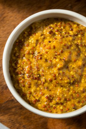 Photo for Organic Brown Spicy Grainy Mustard in a Bowl - Royalty Free Image