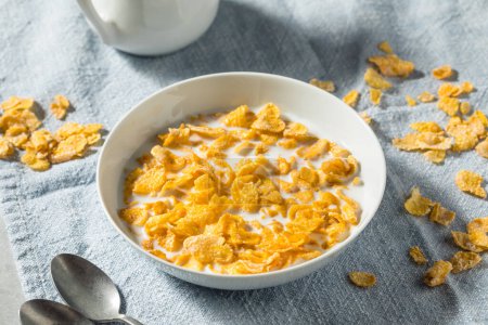Photo for Sweet Organic Frosted Corn Flakes Cereal with Whole Milk - Royalty Free Image