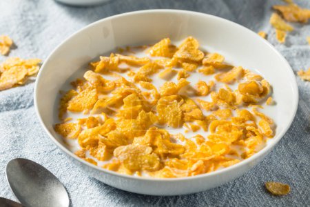 Photo for Sweet Organic Frosted Corn Flakes Cereal with Whole Milk - Royalty Free Image