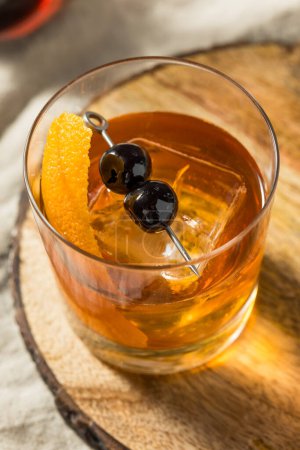 Photo for Boozy Maple Syrup Old Fashioned Cocktail with Bourbon and Cherries - Royalty Free Image