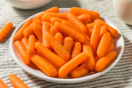 Photo for Orange Organic Raw Baby Carrots in a Bowl - Royalty Free Image