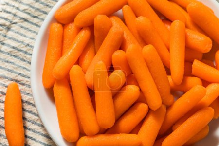 Photo for Orange Organic Raw Baby Carrots in a Bowl - Royalty Free Image