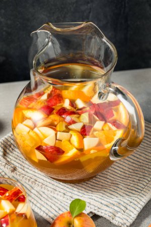 Photo for Cold Refreshing Apple Cider Sangria Cocktail with Wine - Royalty Free Image