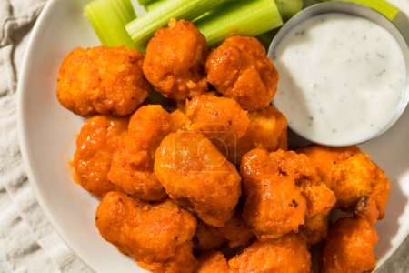 Photo for Homemade Spicy Boneless Buffalo Chicken Wings with Celery and Ranch Dressing - Royalty Free Image