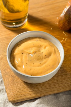 Photo for Homemade Salty Beer Cheese Dip in a Bowl - Royalty Free Image