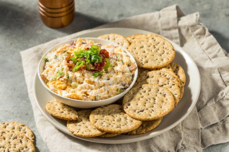 Photo for Homemade Million Dollar Cheese Dip with Bacon and Crackers - Royalty Free Image