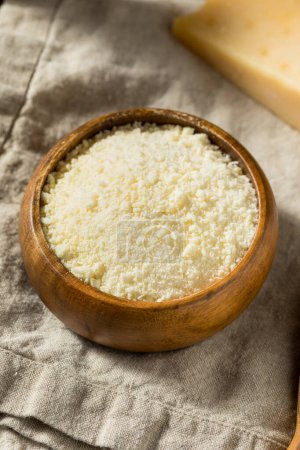 Photo for Healthy White Grated Parmesan Cheese in a Bowl - Royalty Free Image