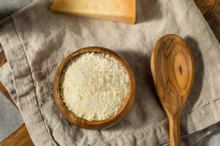 Photo for Healthy White Grated Parmesan Cheese in a Bowl - Royalty Free Image