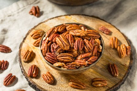 Photo for Raw Organic Dry Pecan Nuts in a Bowl - Royalty Free Image