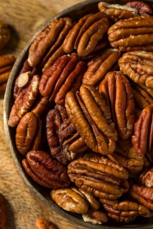 Photo for Raw Organic Dry Pecan Nuts in a Bowl - Royalty Free Image