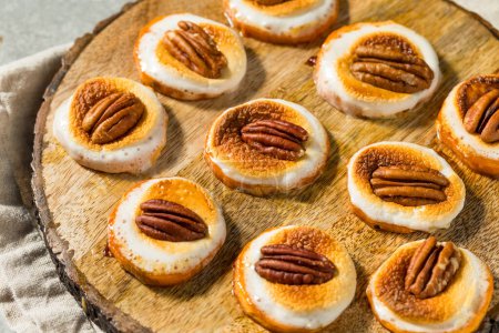 Photo for Homemade Sweet Potato Bites with Marshmallows and Pecans for Thanksgiving - Royalty Free Image