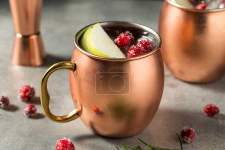 Photo for Boozy Cold Apple Cranberry Moscow Mule with Vodka - Royalty Free Image