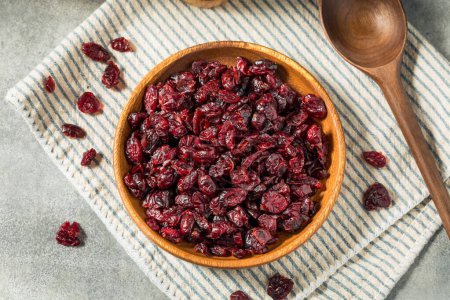 Photo for Organic Raw Dry Cranberries in a Wooden Bowl - Royalty Free Image