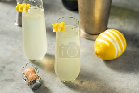 Photo for Bubbly Boozy French 75 Cocktail with Champagne and Lemon - Royalty Free Image