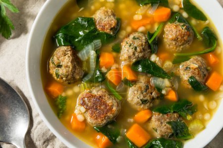 Photo for Hearty Homemade Italian Wedding Soup with Spinach and Meatballs - Royalty Free Image