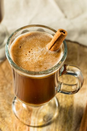 Photo for Warm Boozy Hot Buttered Rum with Cinnamon - Royalty Free Image