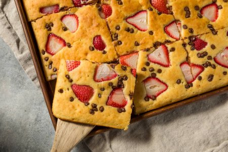 Photo for Homemade Baked Sheet Pan Pancakes with Strawberries and Chocolate - Royalty Free Image