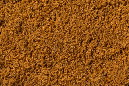 Foto de Orgánica crudo dulce luz marrón azúcar en un tazón - Imagen libre de derechos