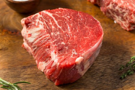 Photo for Raw Grass Fed Filet Mignon Steak with Salt and Pepper - Royalty Free Image