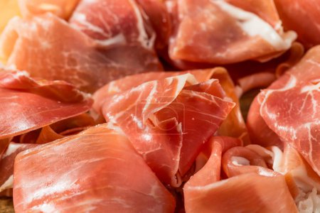 Photo for Organic Salty Parma Ham Prosciutto on a Platter - Royalty Free Image