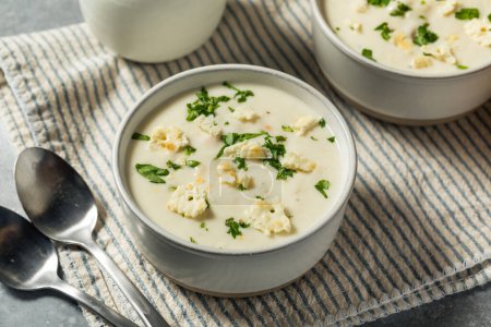 Photo for Chunky New England Clam Chowder with Potato and Crackers - Royalty Free Image