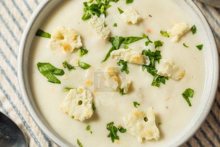 Photo for Chunky New England Clam Chowder with Potato and Crackers - Royalty Free Image