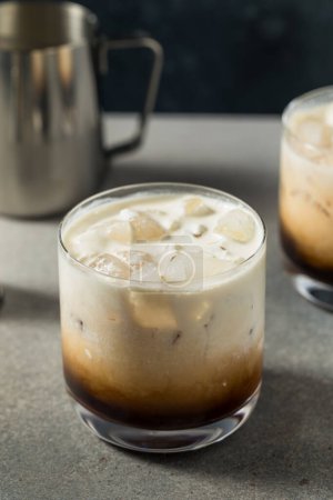 Photo for Refreshing Boozy Vodka White Russian Cocktail with Coffee - Royalty Free Image