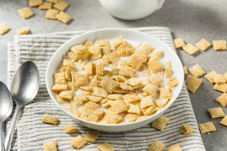 Photo for Healthy Organic Rice Squares Breakfast Cereal with Whole Milk - Royalty Free Image