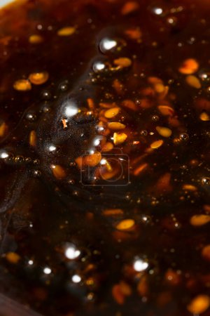Téléchargez les photos : Piment au miel épicé bio Crunch dans un bol - en image libre de droit