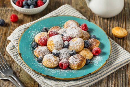 Photo for Homemade Dutch Poffertjes Mini Pancakes with Powdered Sugar - Royalty Free Image
