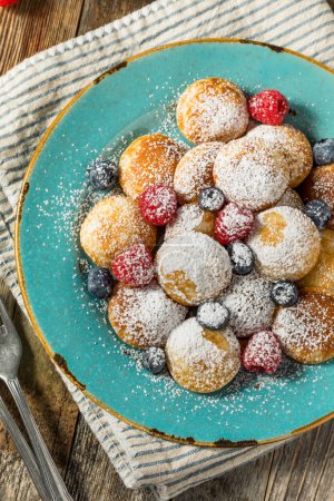 Photo for Homemade Dutch Poffertjes Mini Pancakes with Powdered Sugar - Royalty Free Image