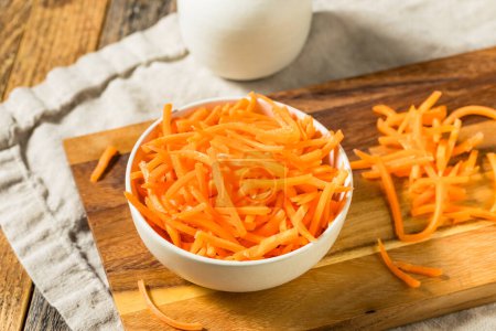 Photo for Organic Raw Shredded Carrot Shreds in a Bowl - Royalty Free Image