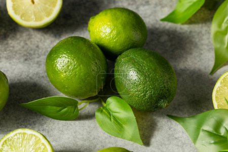 Photo for Organic Raw Green Limes in a Bunch - Royalty Free Image