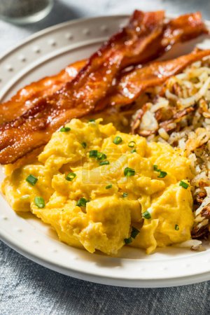 Photo for Healthy Homemade American Bacon Egg and Hashbrown Breakfast with Salt and Pepper - Royalty Free Image