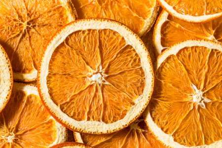 Photo for Healthy Organic Dried Dehydrated Orange Slices in a Bowl - Royalty Free Image