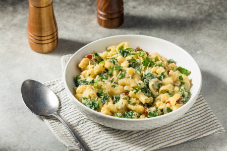 Photo for Healthy Homemade Cavatappi Pasta with Tomatoes Spinach and Basil - Royalty Free Image