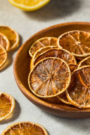 Photo for Dehydrated Dry Lemon Slices in a Bowl - Royalty Free Image
