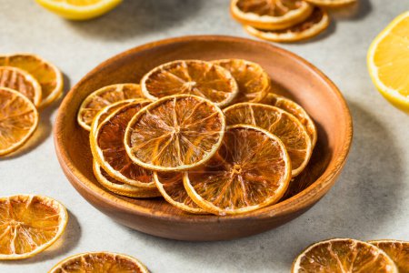 Photo for Dehydrated Dry Lemon Slices in a Bowl - Royalty Free Image