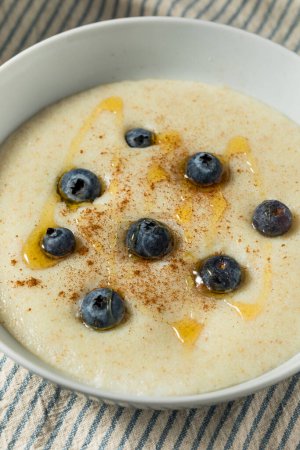 Traditional Healthy Breakfast Wheat Porridge with Honey and Berries