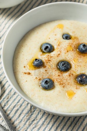 Traditional Healthy Breakfast Wheat Porridge with Honey and Berries