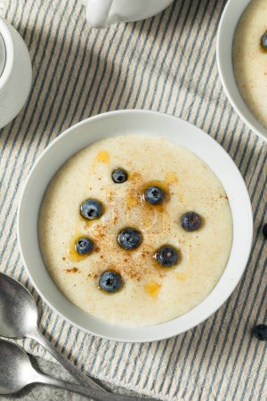 Photo for Traditional Healthy Breakfast Wheat Porridge with Honey and Berries - Royalty Free Image