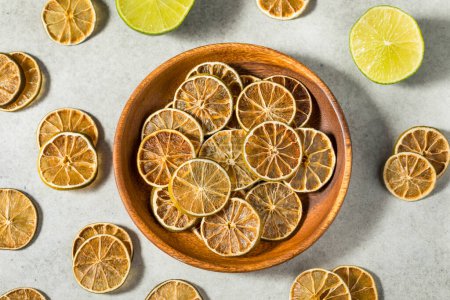 Photo for Organic Dried Dehydrated Lime Slices in a Bowl for Garnish - Royalty Free Image