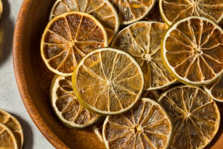 Photo for Organic Dried Dehydrated Lime Slices in a Bowl for Garnish - Royalty Free Image