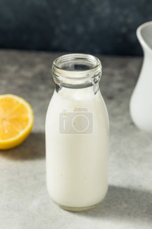 Photo for Cold Refreshing White Buttermilk in a Milk Glass - Royalty Free Image