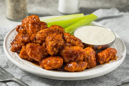 Photo for Spicy Boneless Barbecue Chicken Wings with Ranch and Celery - Royalty Free Image