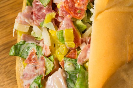 Photo for Trendy Homemade Chopped Italian Sub Sandwich with Salami and Mayo - Royalty Free Image