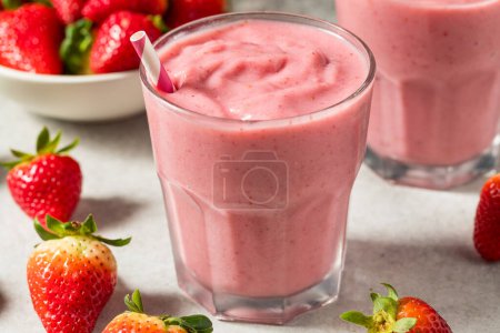 Photo for Healthy Red Organic Strawberry Smoothie with Almond Milk for Breakfast - Royalty Free Image