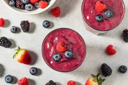 Photo for Healthy Refreshing Mixed Berry Breakfast Smoothie with Raspberries and Blueberries - Royalty Free Image